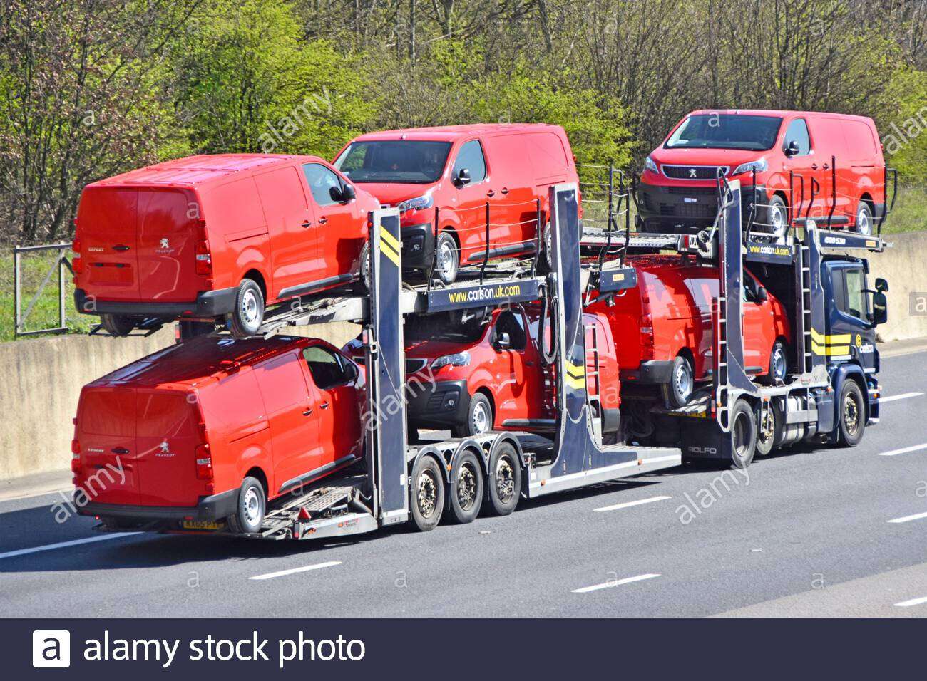 Attached picture loaded-lorry-truck-car-distribution-transporter-trailer-to-transport-deliver-six-new-red-peugeot-expert-brand-of-vans-driving-on-motorway-england-uk-2F6PA64 (1).jpg